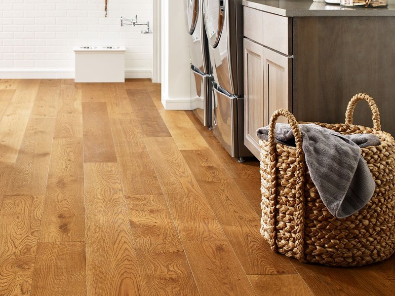 Laundry room with wood-look luxury vinyl flooring from Perge Carpet & Floors in Wheaton, MD